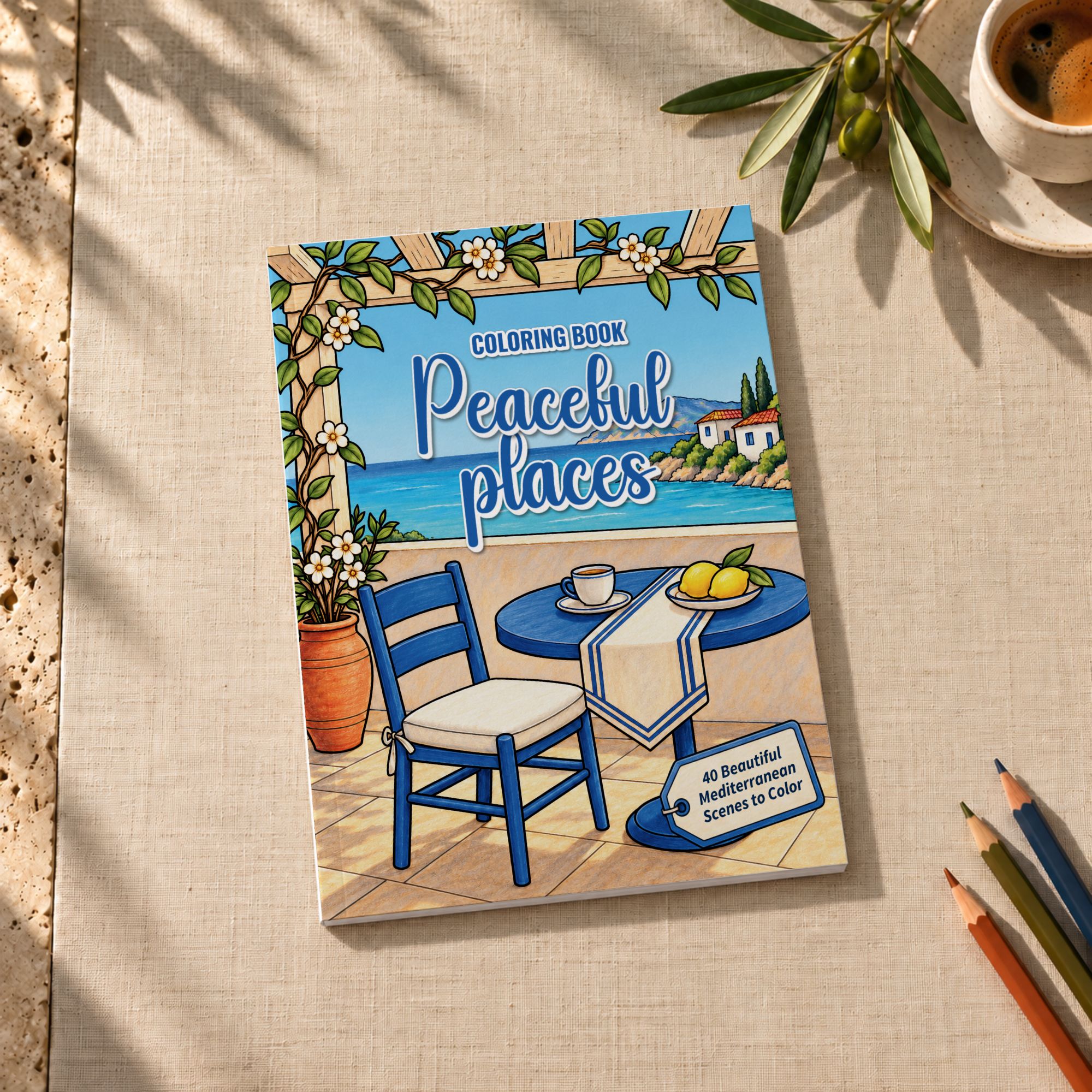 Digital mockup of Peaceful Places on linen, with colored pencils and a cup